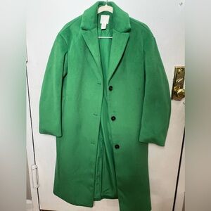 Green woman’s oversized peacoat from H&M.